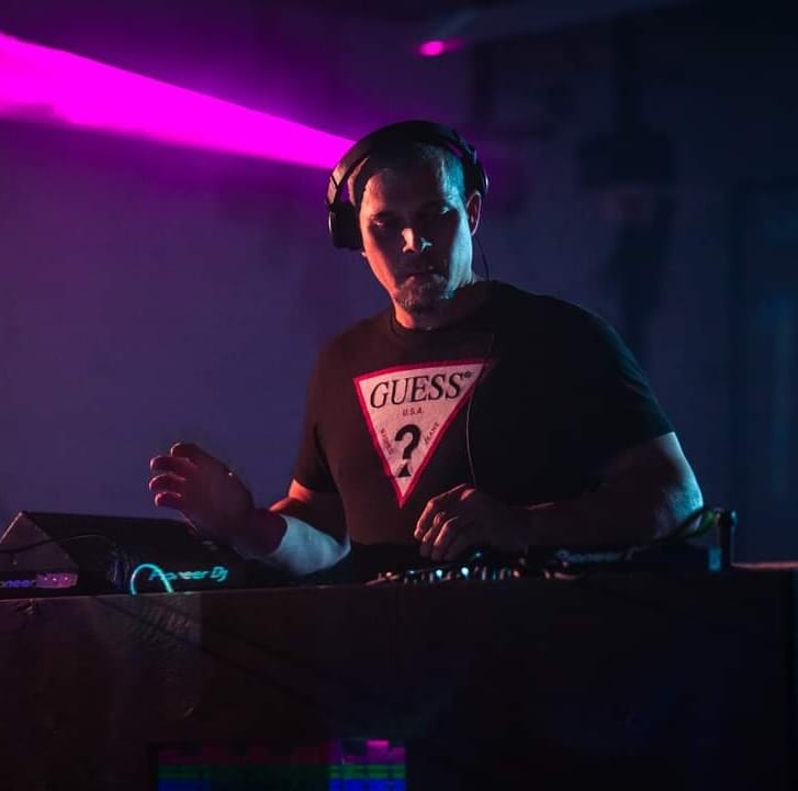 DJ in Club with purple light