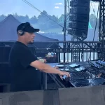 DJ at decks on stage
